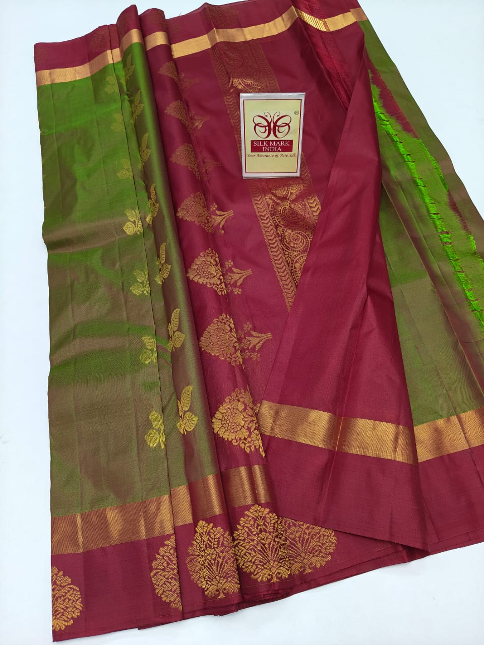 Kanjivaram Silk Saree – Burgundy & Green Leaf Color with Zari Border