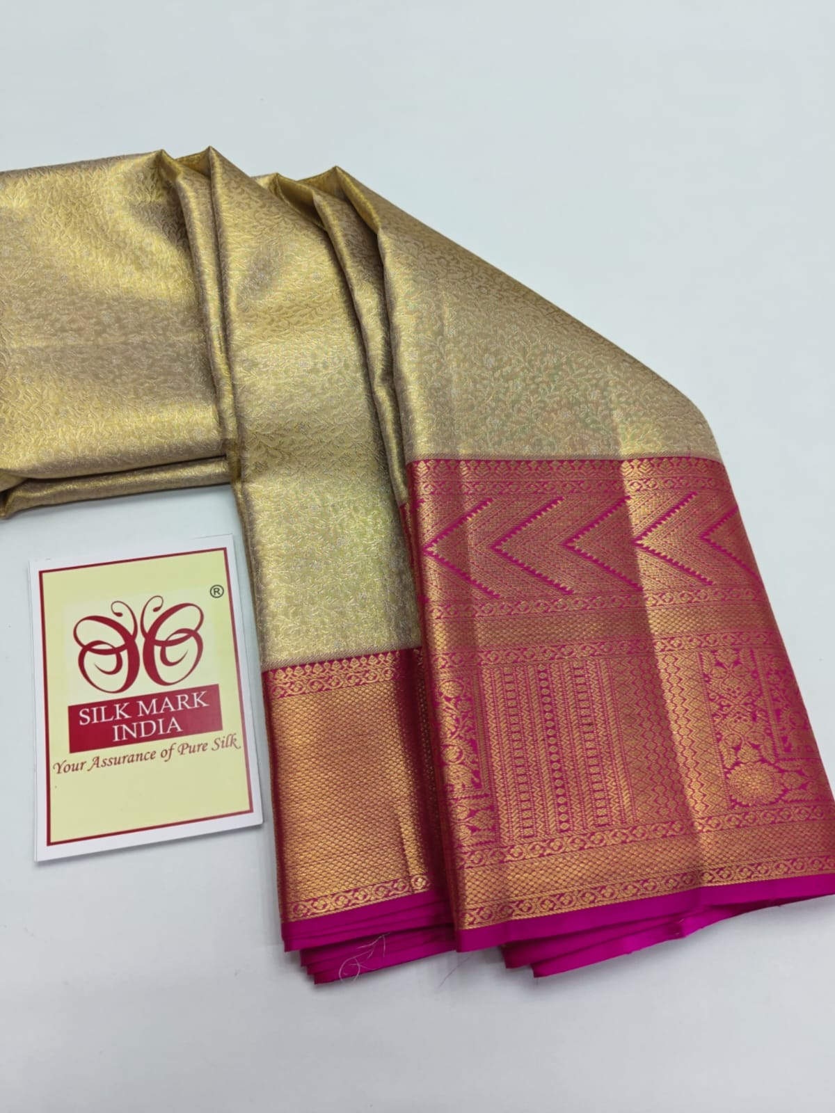 Silk Mark Certified Champagne Gold & Amber Tissue Kanjivaram Pure Silk Saree with Rani Pink Border & Geometric Chevron Brocade