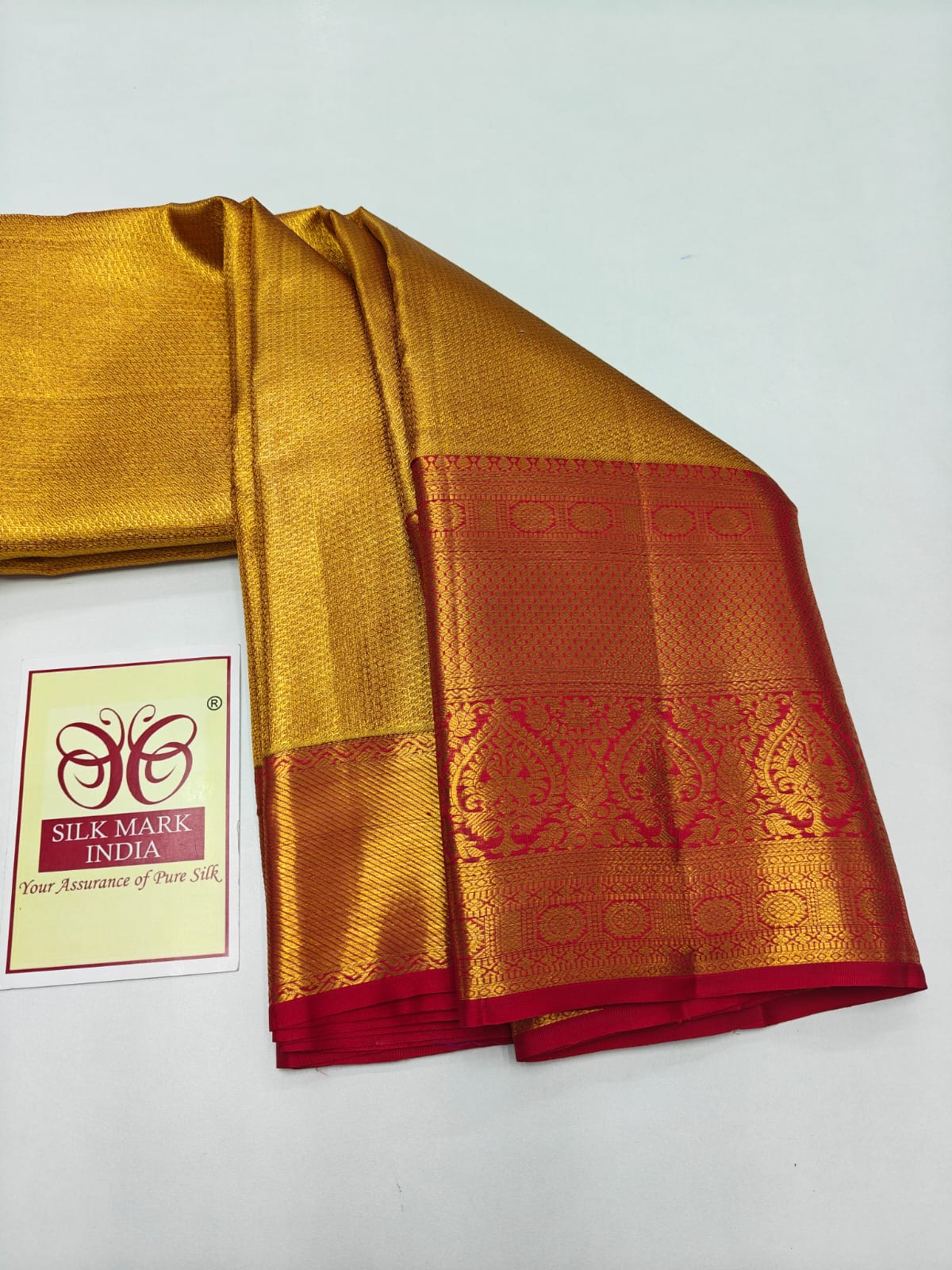 Silk Mark Certified Metallic Amber Gold Tissue & Crimson Red Kanjivaram Pure Silk Saree with Paisley Zari Border