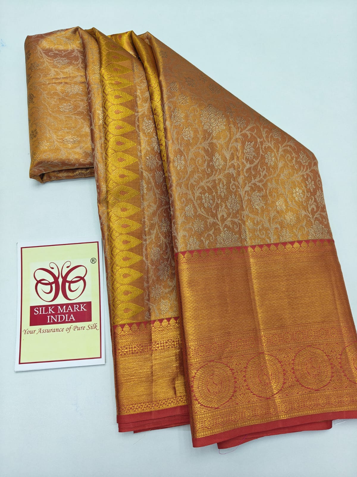 Silk Mark Certified Amber Gold Tissue & Coral Pink Kanjivaram Pure Silk Saree with Floral Jaal & Medallion Border
